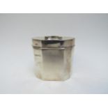 An Alfred Marston silver tea caddy, handle mounted to top, faceted body, Chester 1920, 8.2cm x 9cm x