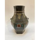 An Eastern hexagonal heavy metal cloisonné vase with elephants mask handles, 31cm tall