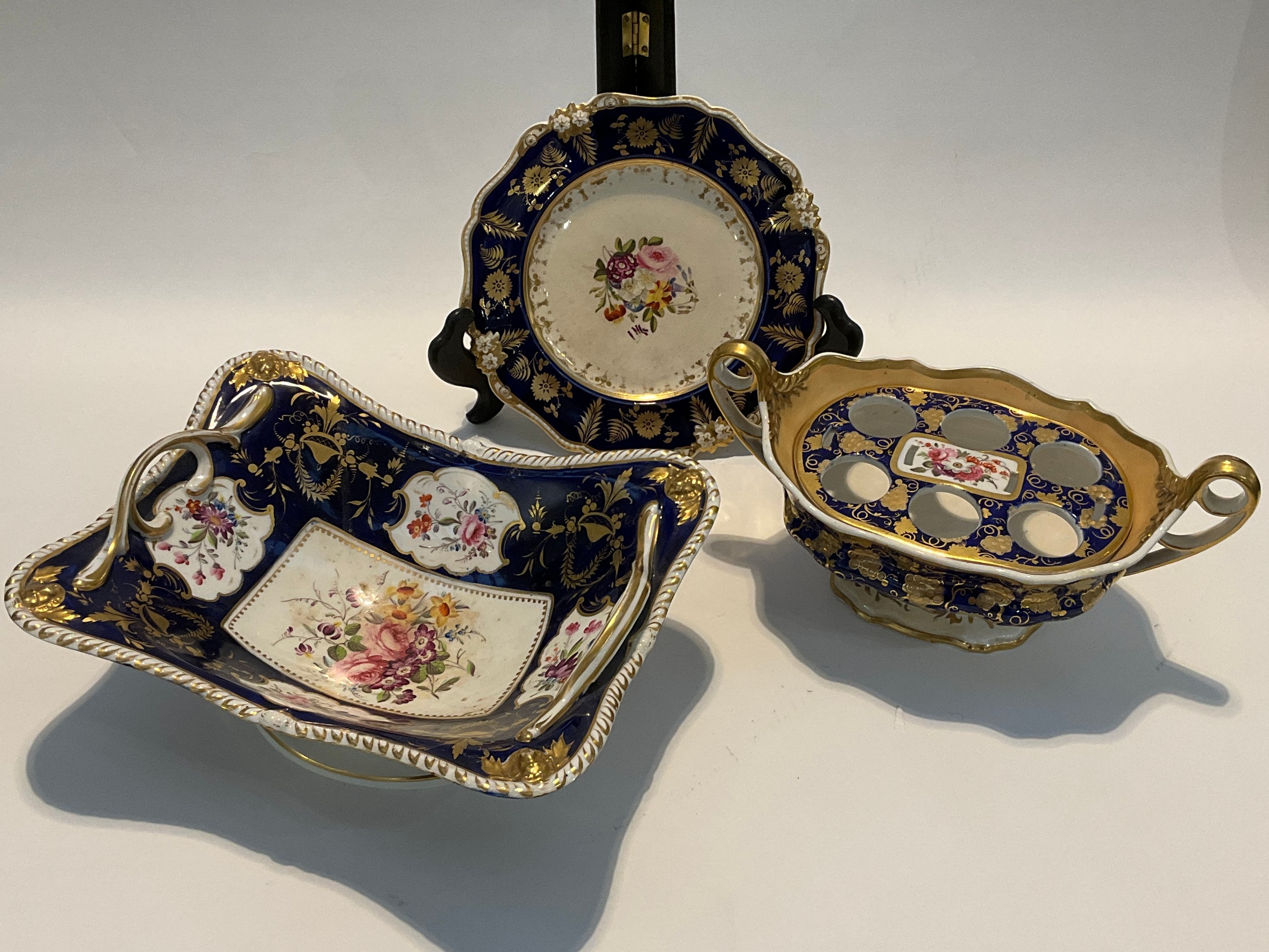 A quantity of Bloor Derby table wares, cobalt and gilt design, including centrepiece bowl, lidded