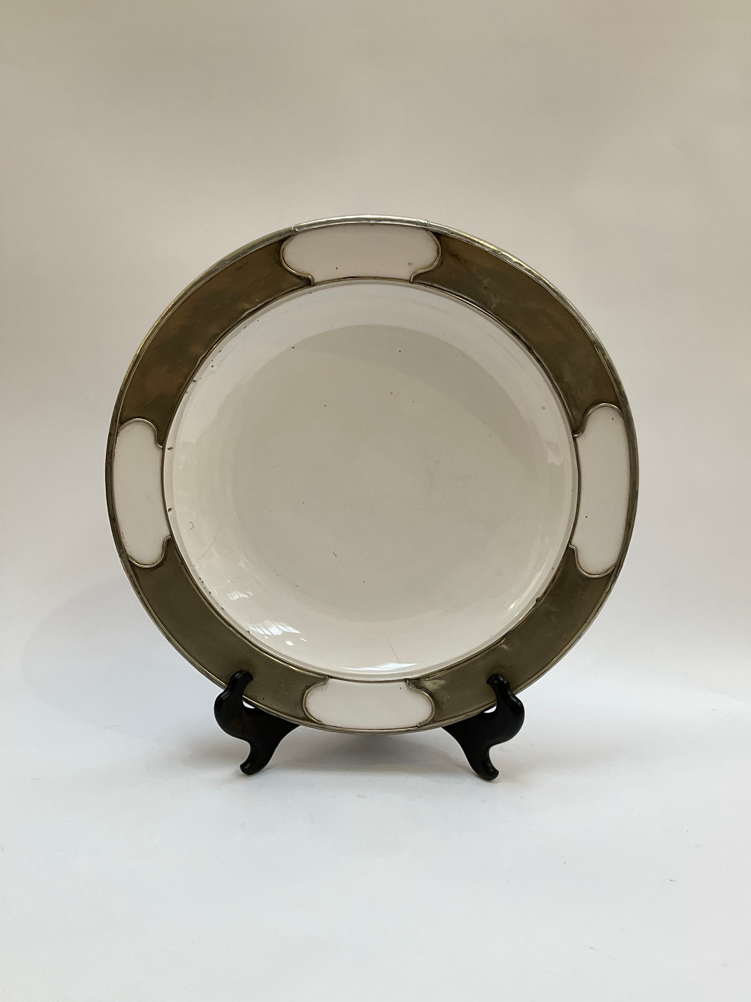 A large white bowl with a white metal bound border, 41cm diameter