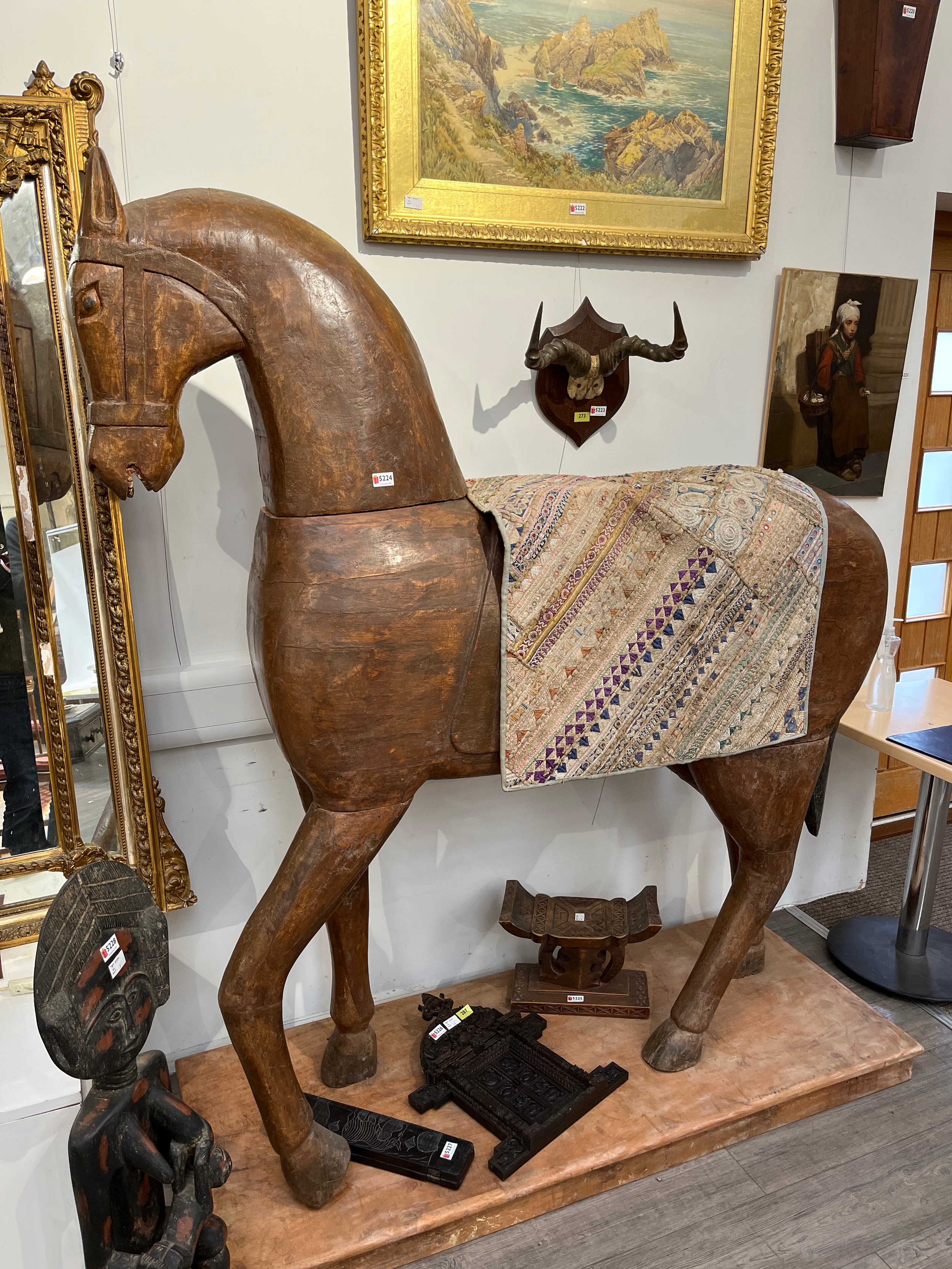 A pair of Rajasthan carved wooden horses of life size 'Marwar' horses on plinth bases, and two