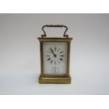 An early 20th Century brass carriage clock with Alarm dial, 11.5cm tall