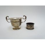 A William Hutton & Son silver twin handled sugar bowl, Birmingham 1905 and a Walker & Hall napkin