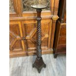 A pair of mahogany barley twist candlestands/torcheres, 125cm tall