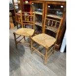 A set of four Regency bamboo effect chairs, turned spindle back supports, seagrass seats, one