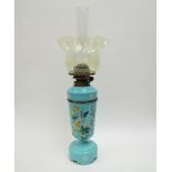 A Victorian painted turquoise glass oil lamp decorated with a bird, with Vaseline glass shade,