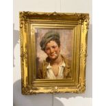 ANTONIO VALLONE (XX): An oil on board portrait ‘A Young Boy Smoking’, signed, framed and glazed,