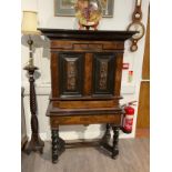 A 19th Century French rosewood and ebony cabinet on stand, top drawer above two doors opening to