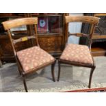 A pair of Regency rosewood dining chairs with boulle work style to backs, upholstered drop in seats,