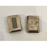 Two silver vesta cases one with Armorial crest, 45g