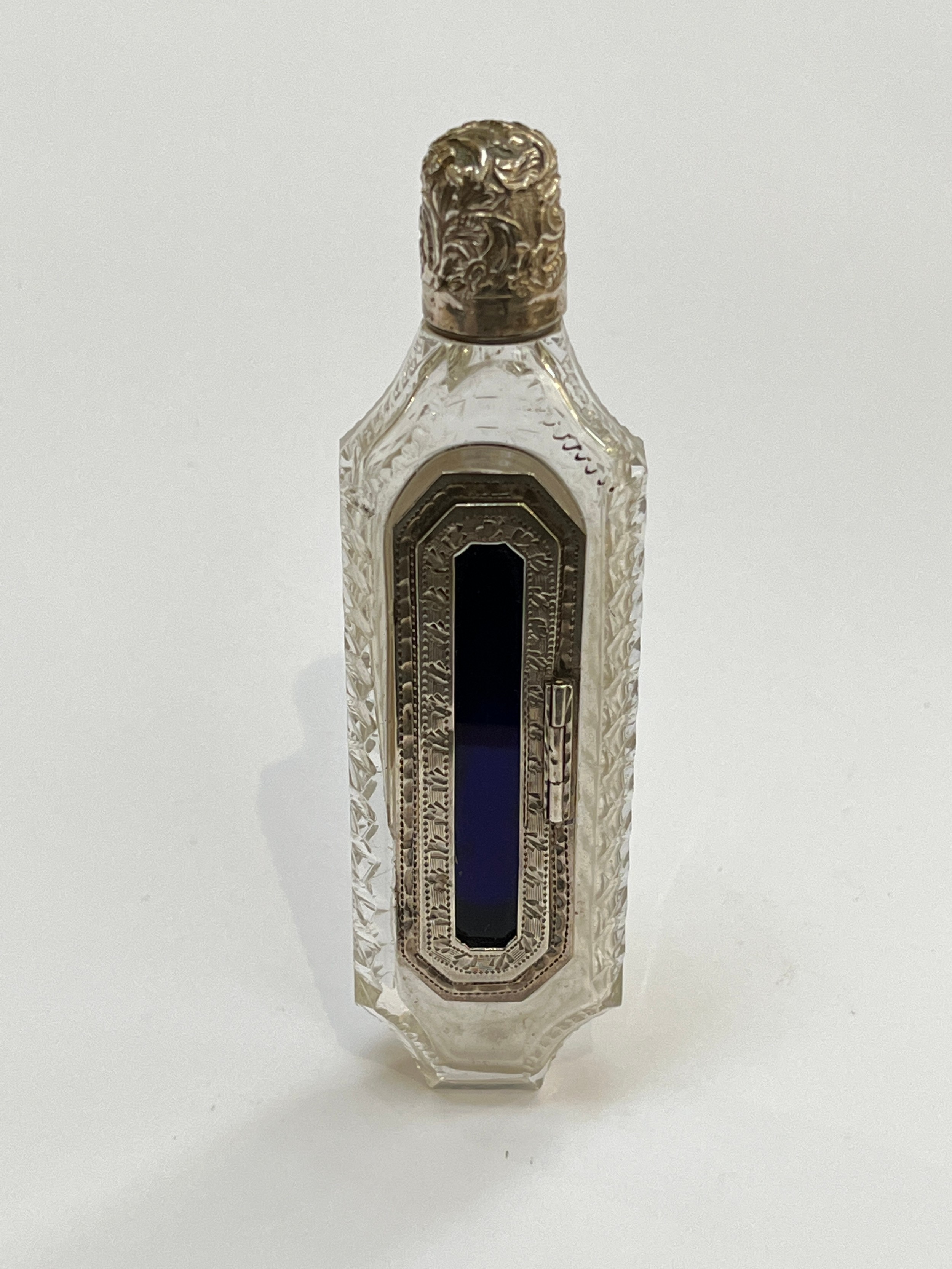 A Victorian cut glass scent bottle with Bristol blue glass and silver hinged compartment, maker