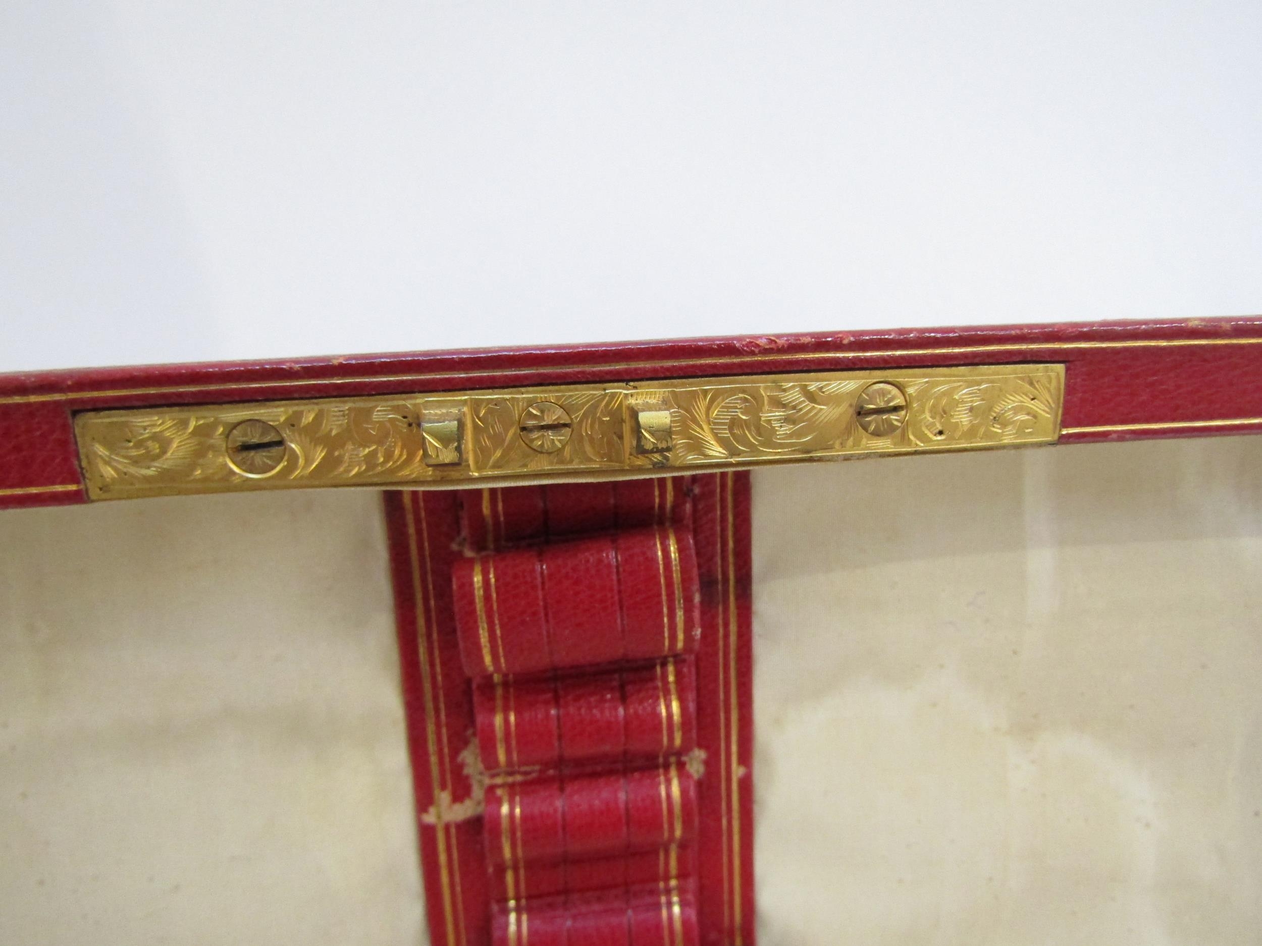 A 19th Century red leather casket with gilt tooled decoration to the exterior. With key. 27cm x 17cm - Image 19 of 22
