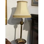A pair of brassed column form table lamps with shades, 68cm tall