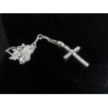 A 9ct white gold diamond set cross pendant hung on a white gold chain, stamped 375, 50cm long, 1.9g