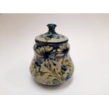 A William Moorcroft Hesparian ware "Daisy" pattern baluster form biscuit barrel for Liberty & Co,