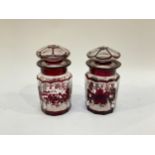 A pair of Victorian ruby overlay lidded jars, 15.5cm tall