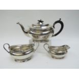 A Charles S Green & Co., silver three piece tea set consisting of teapot, sucrier and milk jug,