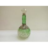 An Arthur Willmore Pennington emerald cut glass scent bottle, with pierced foliate scrolled detail