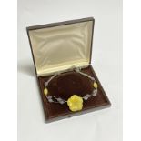 A jadeite necklace with large yellow jadeite carved lotus flower centre