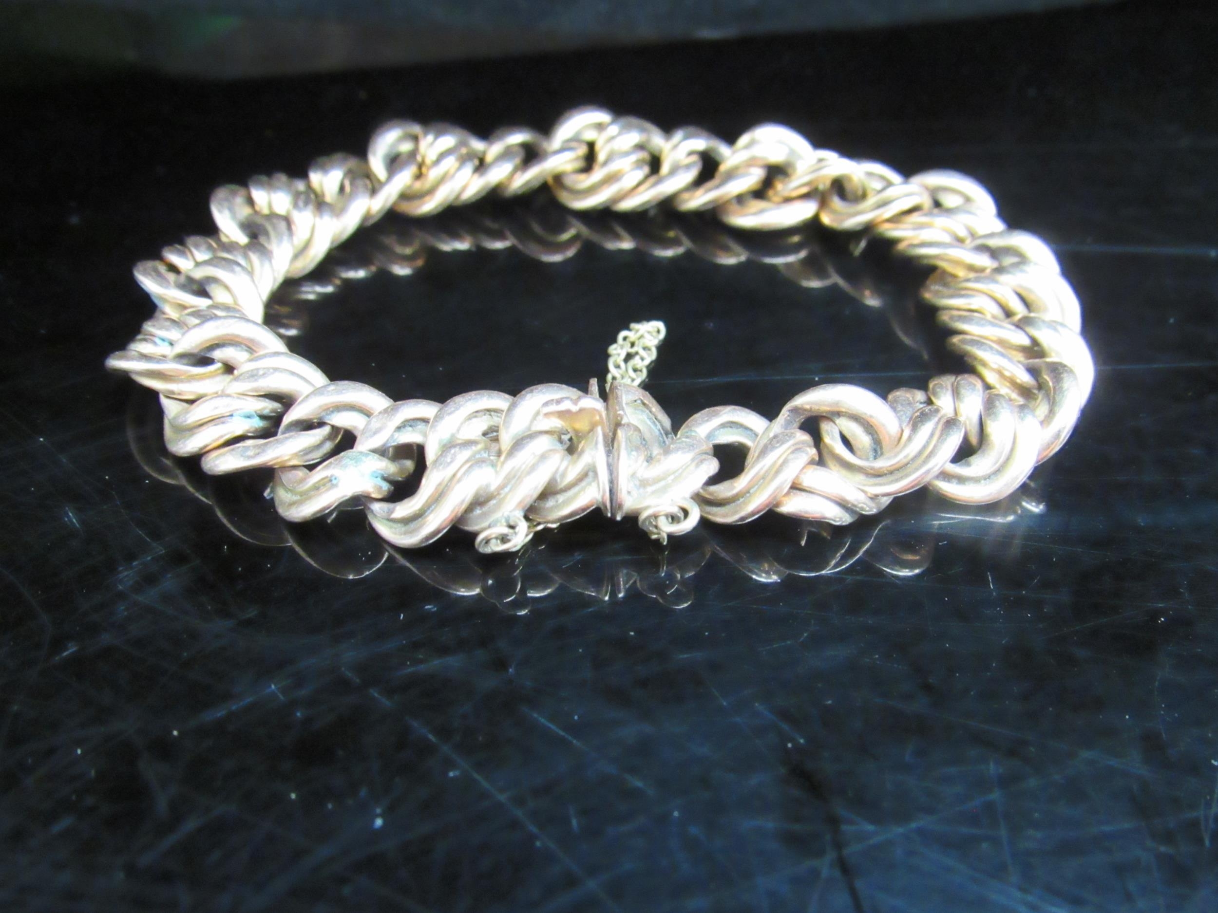 A gold fancy link bracelet stamped 15, 25g