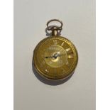 A gold cased open faced pocket watch, the gold face with Roman numerals overlaid around the dial,