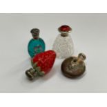 Four various scent bottles, one of strawberry form, one with red guilloche silver lid