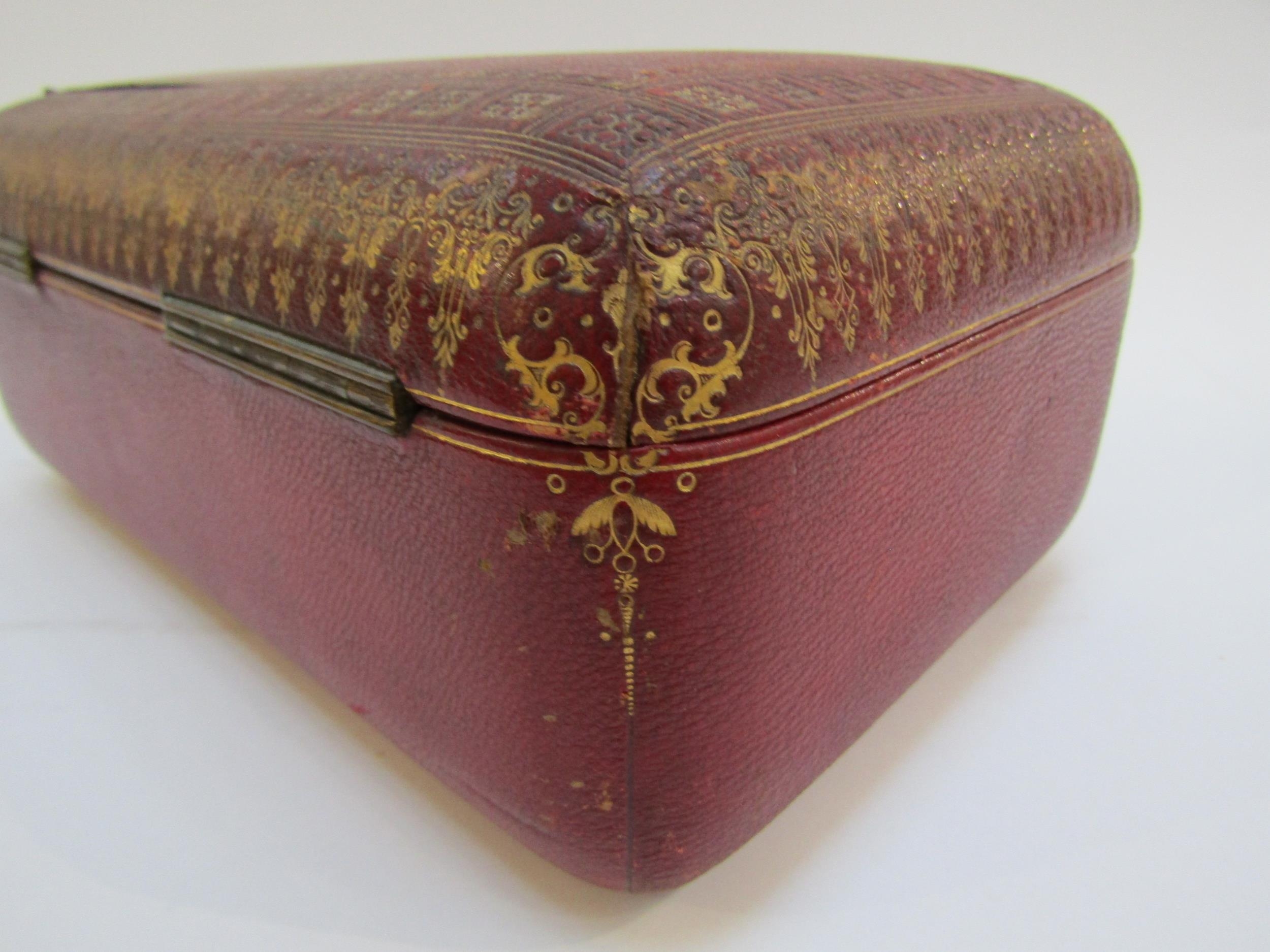 A 19th Century red leather casket with gilt tooled decoration to the exterior. With key. 27cm x 17cm - Image 7 of 22