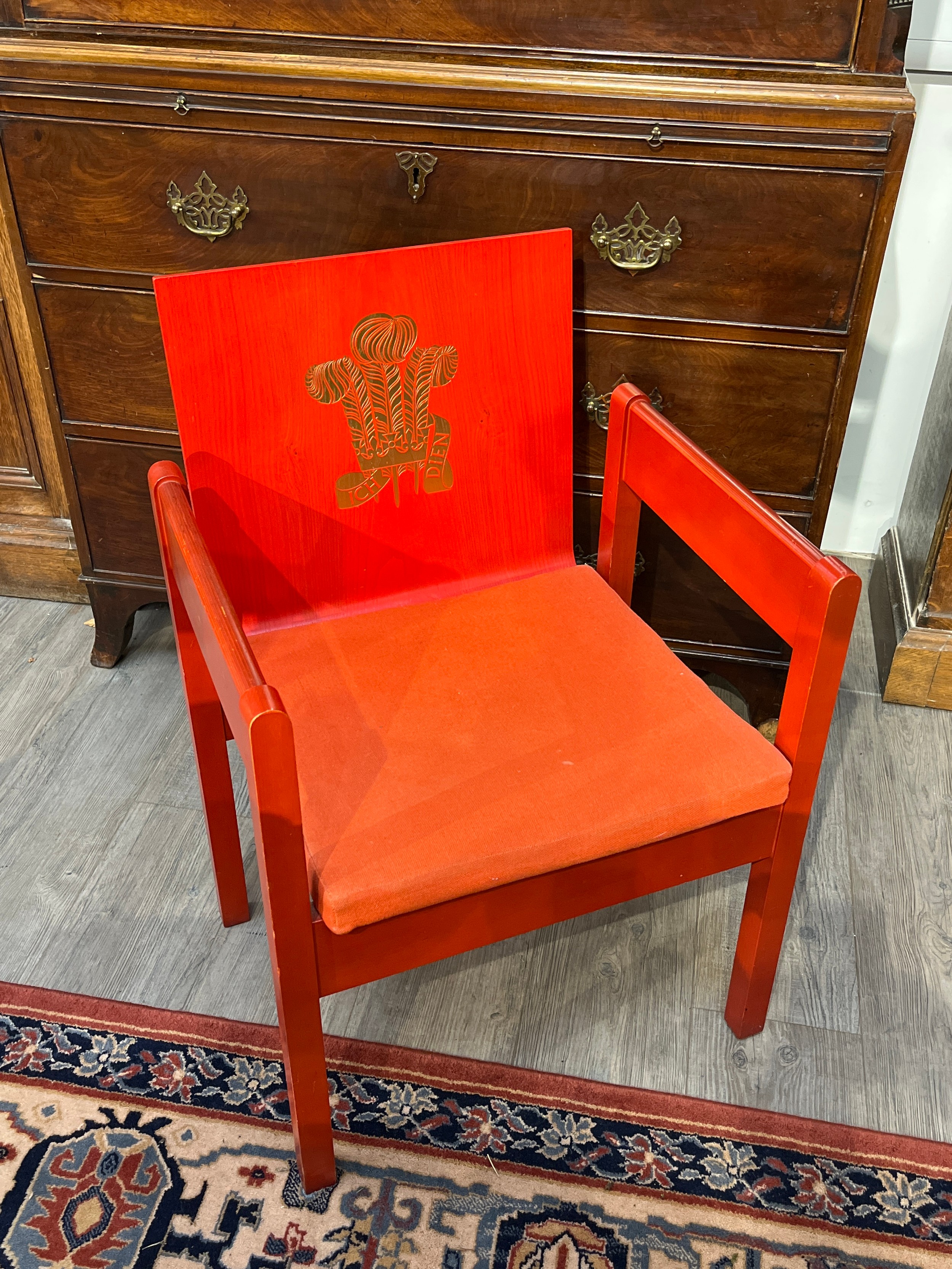 A Prince of Wales Investiture chair frame, as designed by Lord Snowdon, red stained plywood bentwood