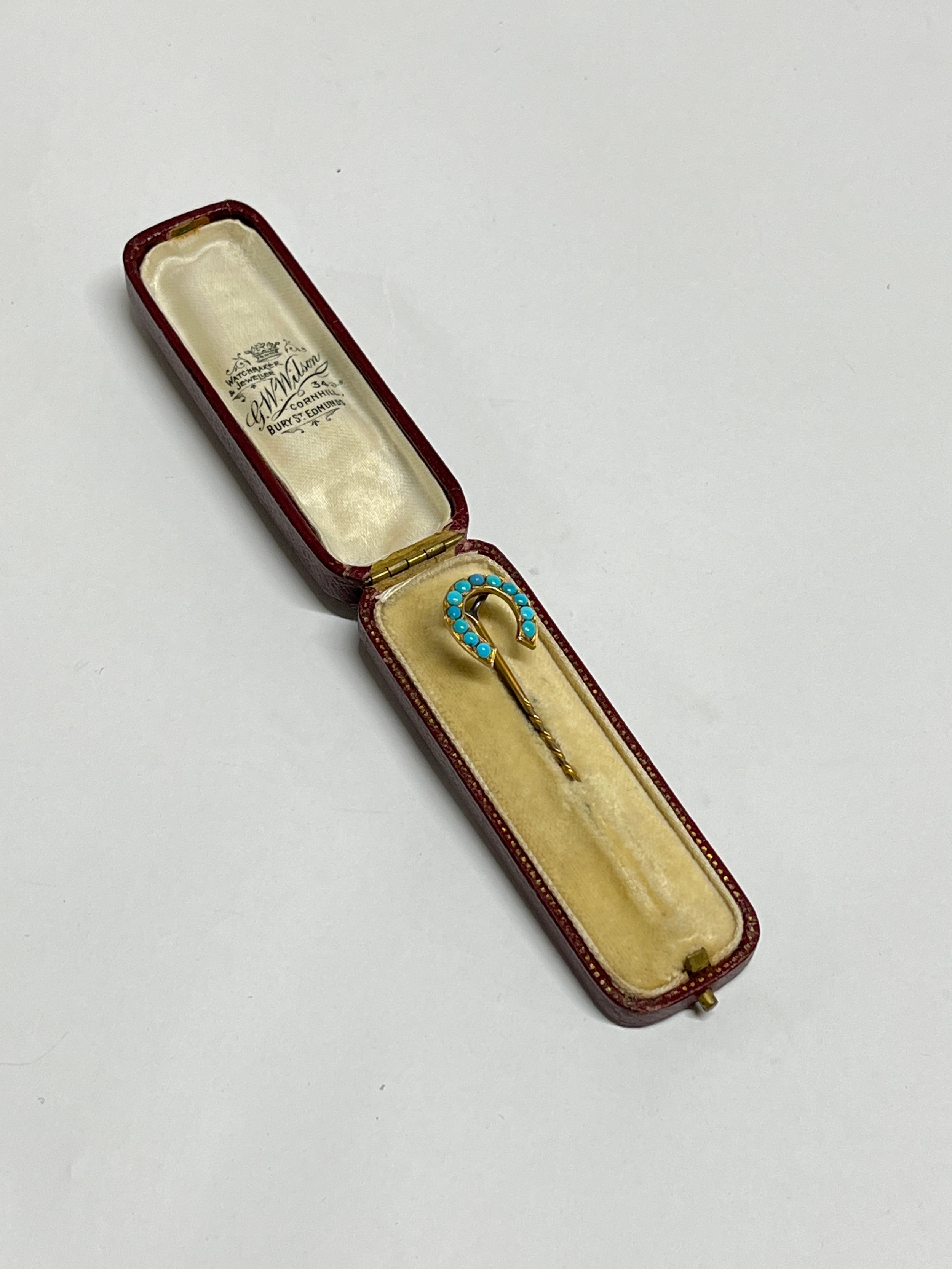 A Victorian gold and turquoise stickpin in box, unmarked