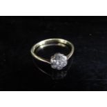 A gold diamond daisy ring stamped 18ct. Size N/O, 1.5g