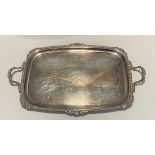 A silver twin handle tray with central monogram, made by Goldsmiths & Silversmiths London 1890, 78cm