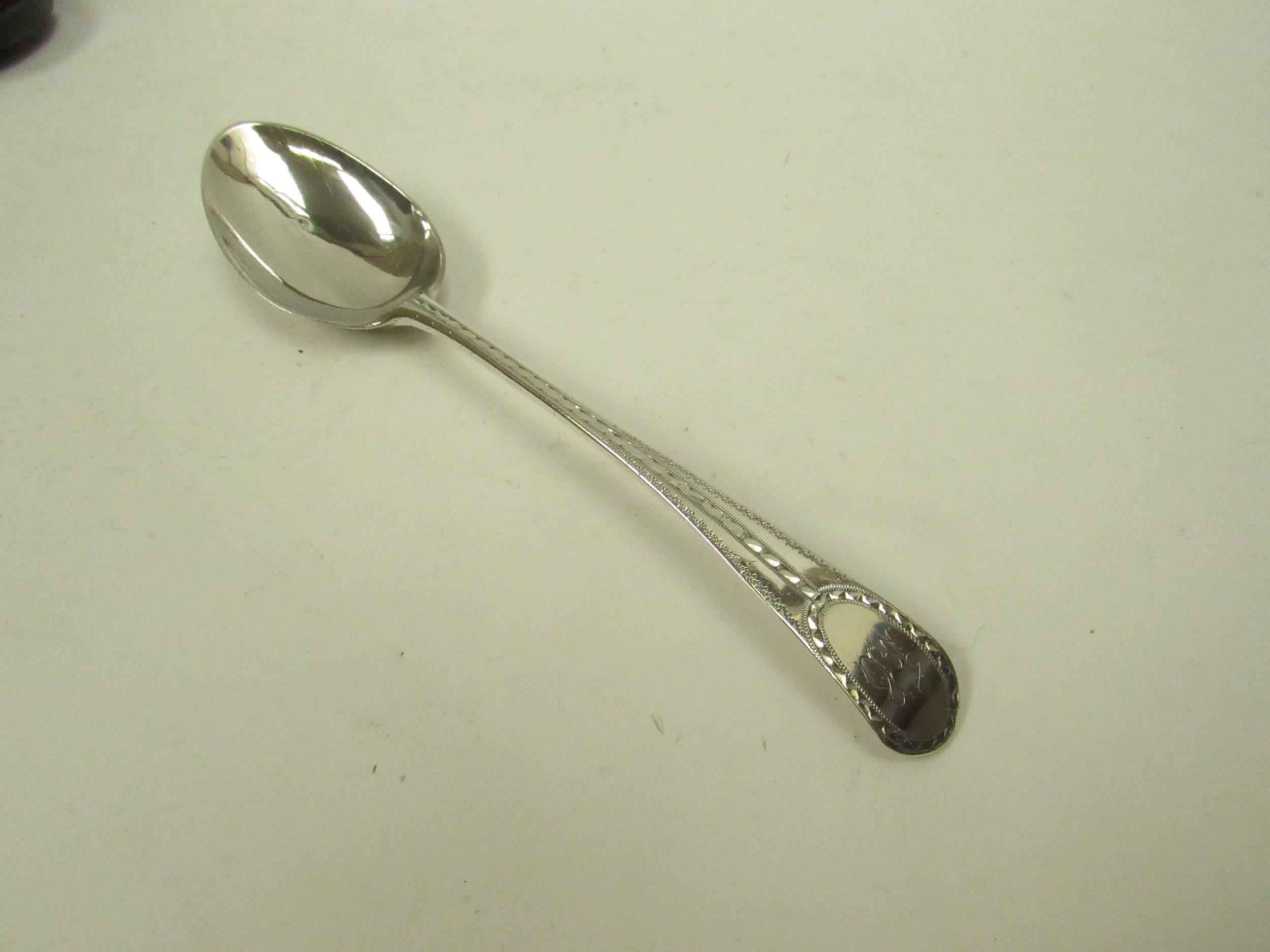 A silver spoon with bright cut detail marks indistinguishable in Mappin & Webb case, 24g - Image 2 of 3