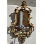 A late 18th/early 19th Century girandole mirror of pear form, areas of damage and pieces missing,