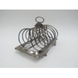 A Georgian Soloman Hougham silver seven bar toast rack, monogrammed 18.5cm long x 12.5cm tall, 429g