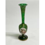 A late 19th / early 20th Century green glass vase, porcelain hand-painted panel applied to side,