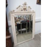 A 19th Century French painted wall mirror, broken arch pediment with central stylised shield with