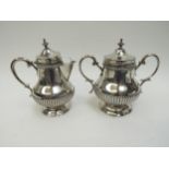 A Portuguese silver lidded coffee canister and pot with melon fluted detail, 16cm tall, 593g,
