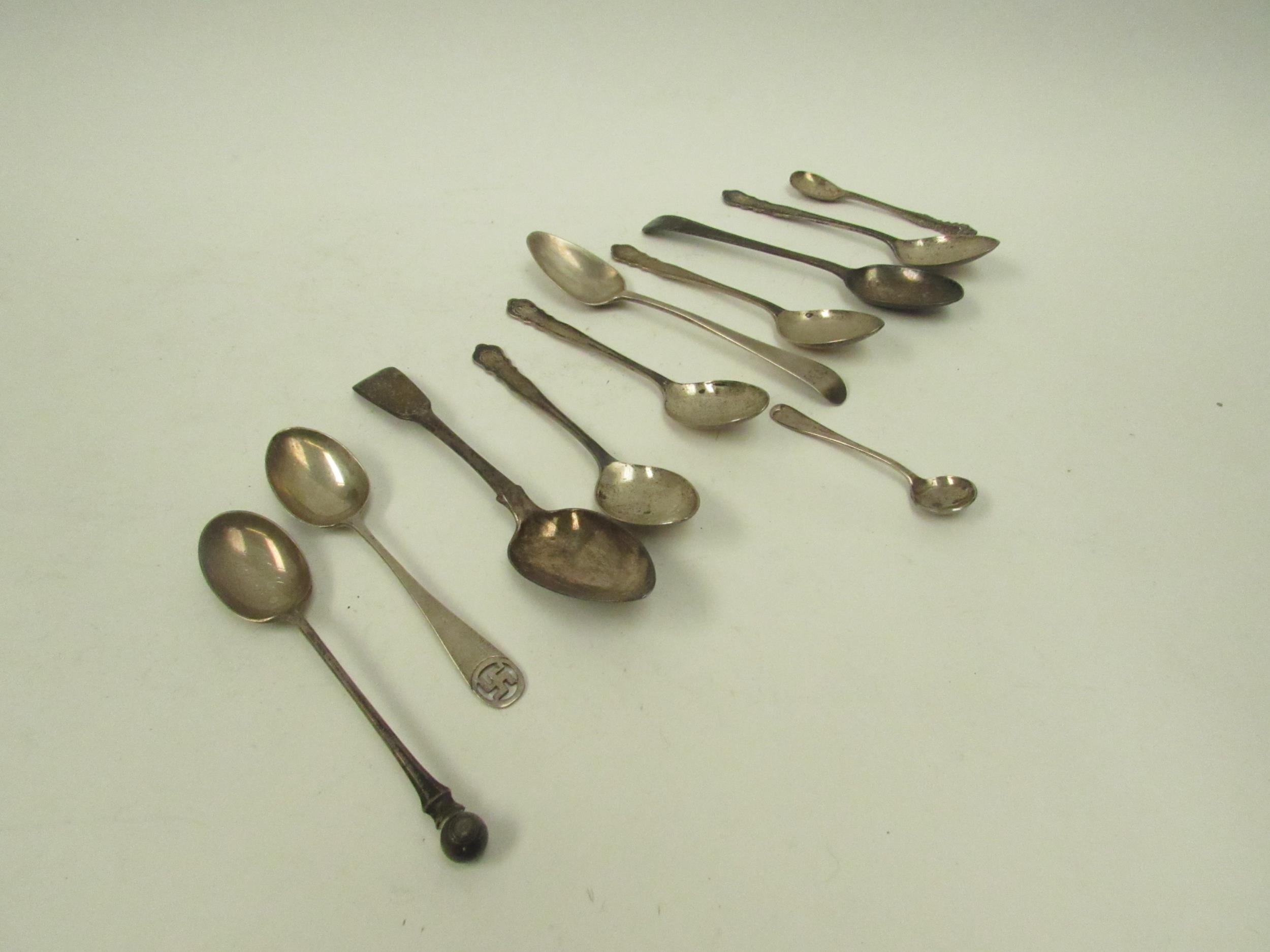 A quantity of mixed silver teaspoons, condiment spoons and baby rattle, 136g