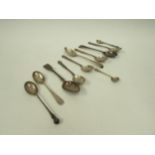 A quantity of mixed silver teaspoons, condiment spoons and baby rattle, 136g