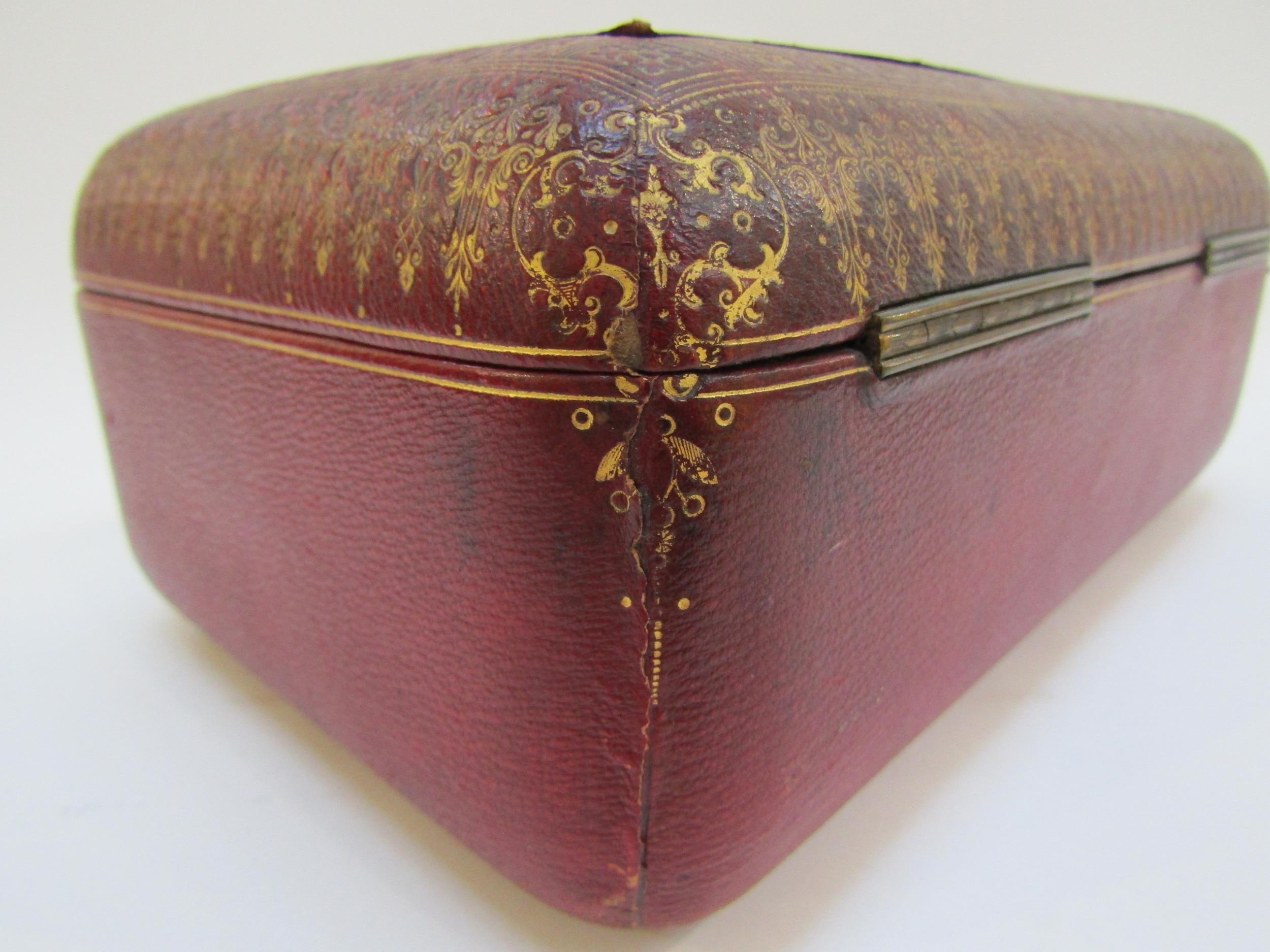 A 19th Century red leather casket with gilt tooled decoration to the exterior. With key. 27cm x 17cm - Image 6 of 22