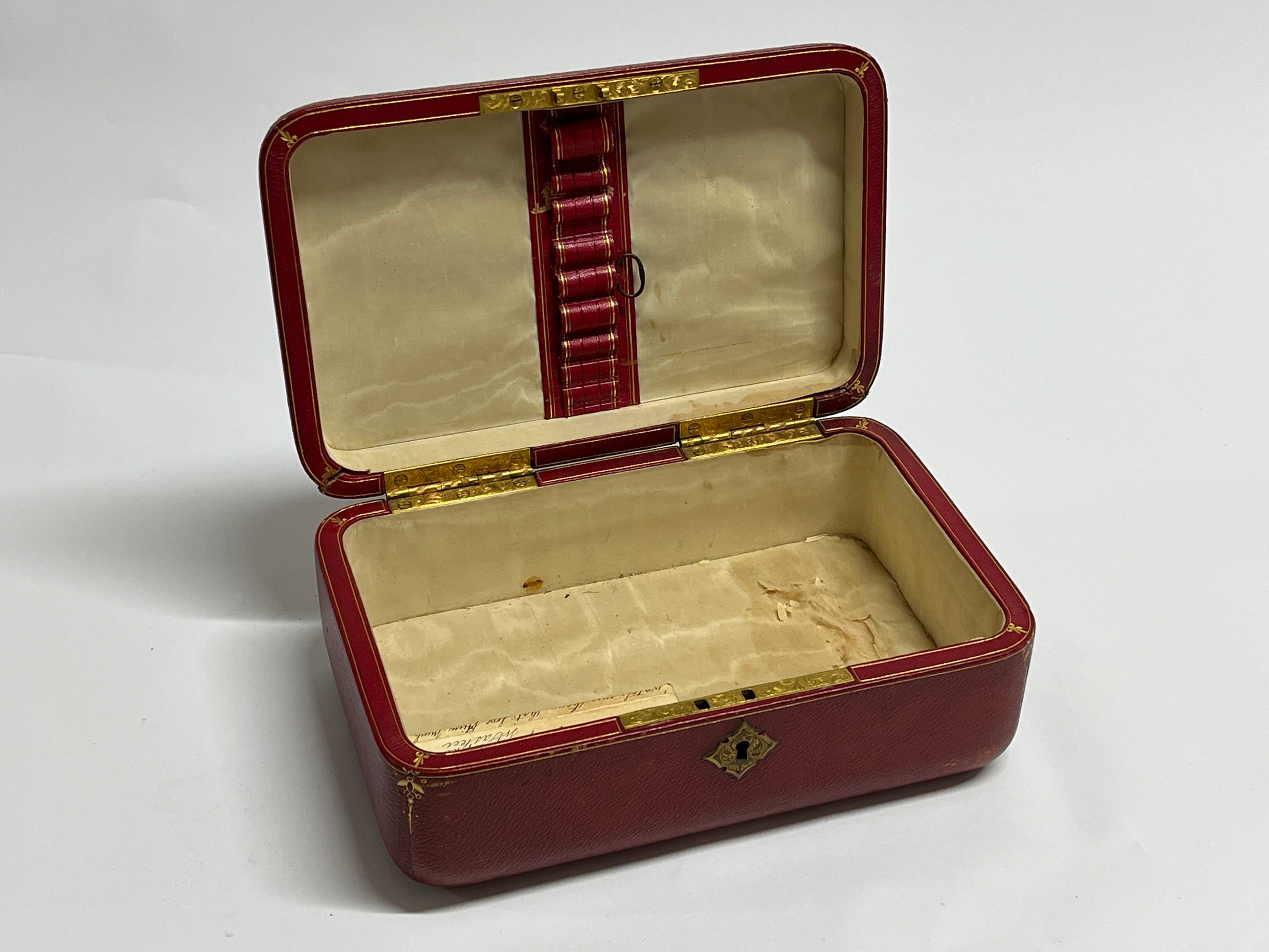 A 19th Century red leather casket with gilt tooled decoration to the exterior. With key. 27cm x 17cm - Image 4 of 22