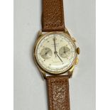 A 1950's 18K gold cased Swiss-made chronograph, 17 jewels, with chrono and second dials, stylised