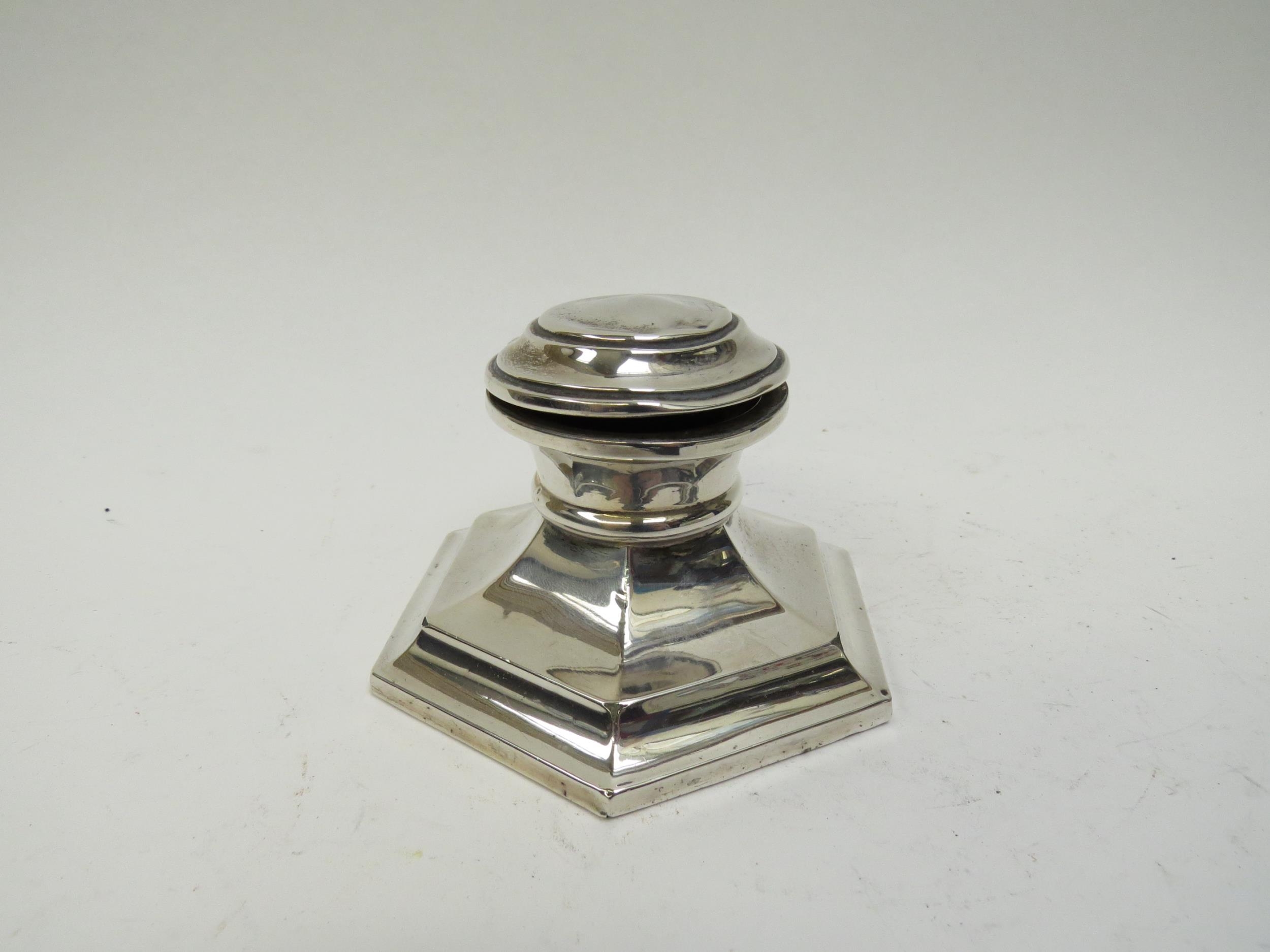 A silver capstan inkwell (lacking liner), dents to top, weighted base, 10cm long, date letter rubbed