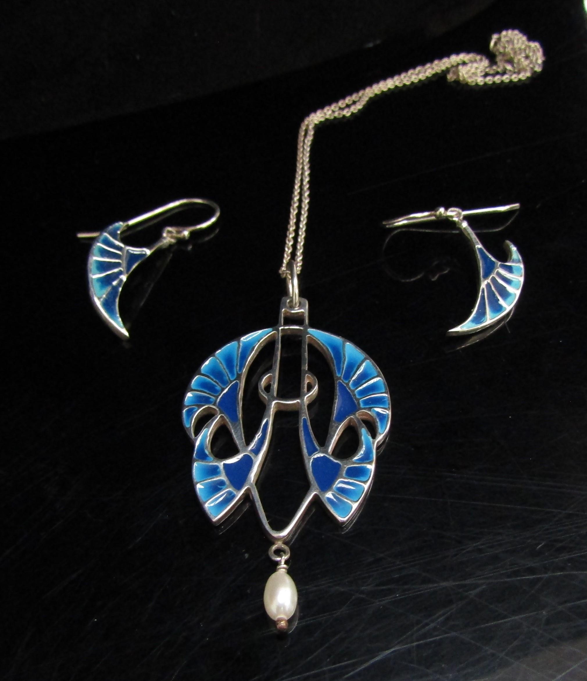 An Art Nouveau revival silver and enamel pendant necklace with pearl drop, and matching earrings