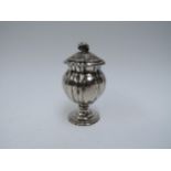 A Richard Pearce & George Burrows silver pepperette of pedestal lobed form, London 1828, marks
