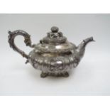 A Smith & Gamble silver teapot, all over foliate relief, Dublin 1832, inscribed cartouches, ivory