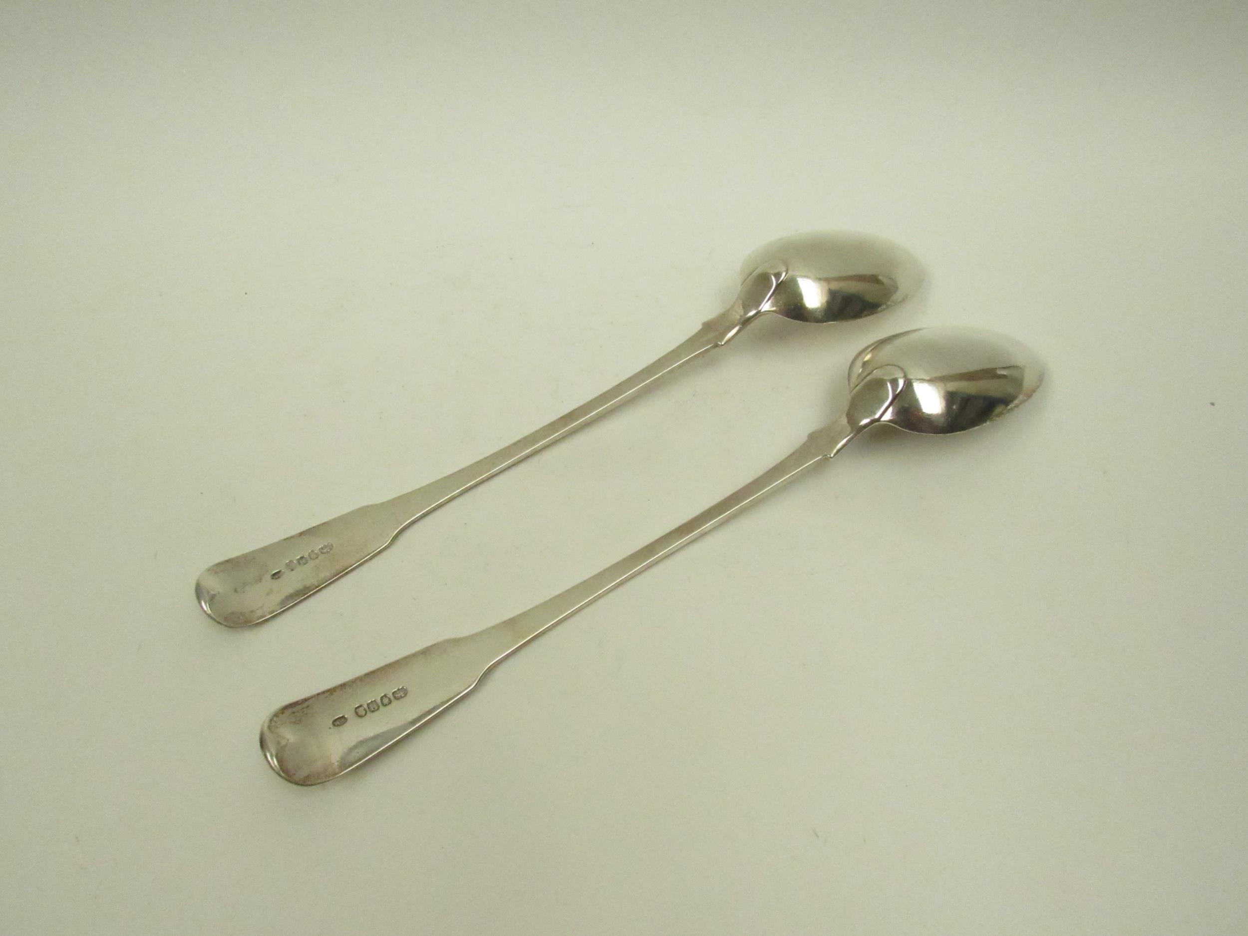 A pair of William Sumner I silver basting / stuffing spoons, family crest to terminal, London - Image 3 of 4