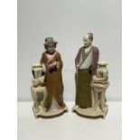A large pair of Royal Worcester figures - a standing Japanese man and woman, designed by James