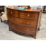Circa 1860 a flame mahogany and black line crossbanded bow front chest of two short over two