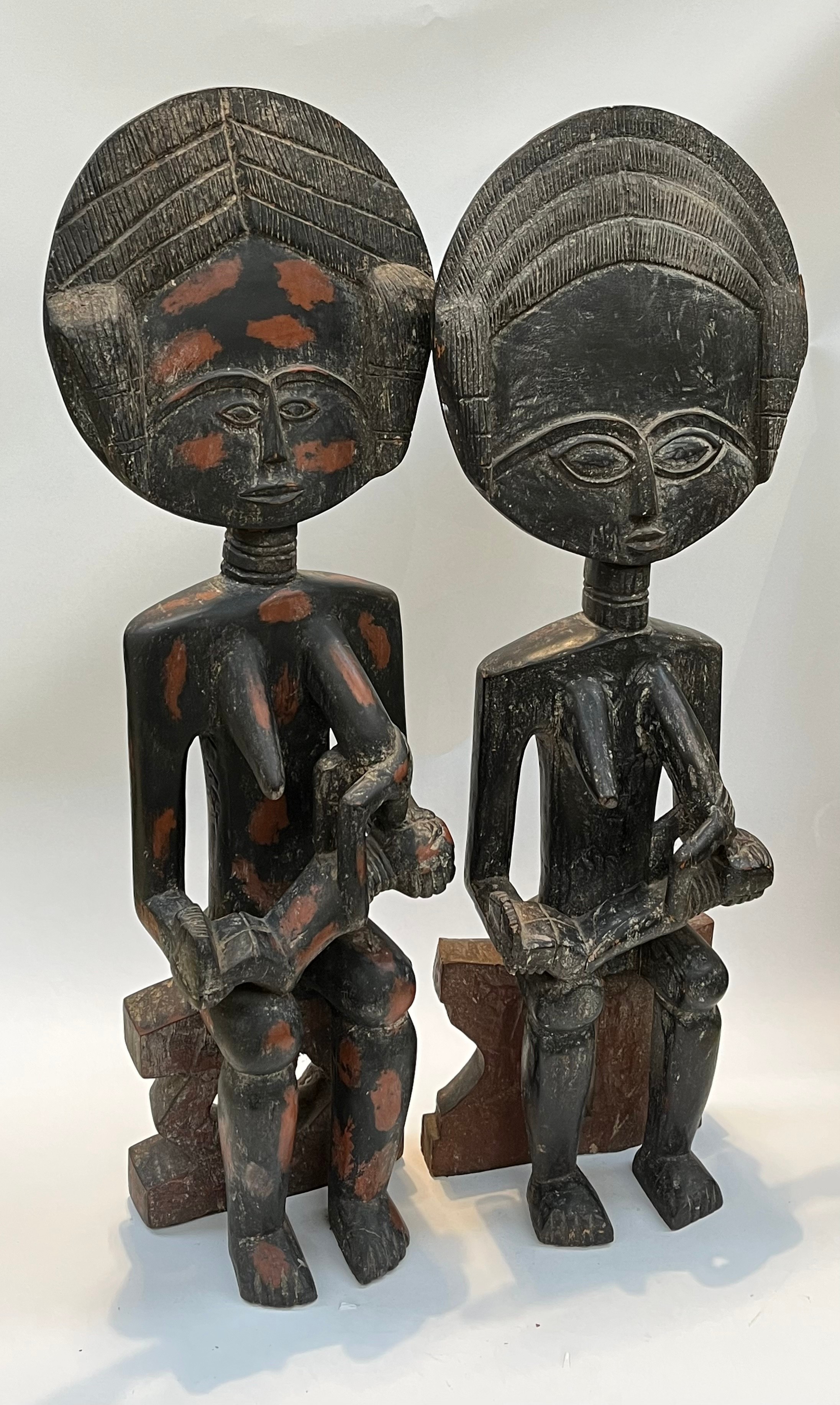 A pair of Northern Ghanaian carved wood fertility figures, standing 90cm and 92cm tall